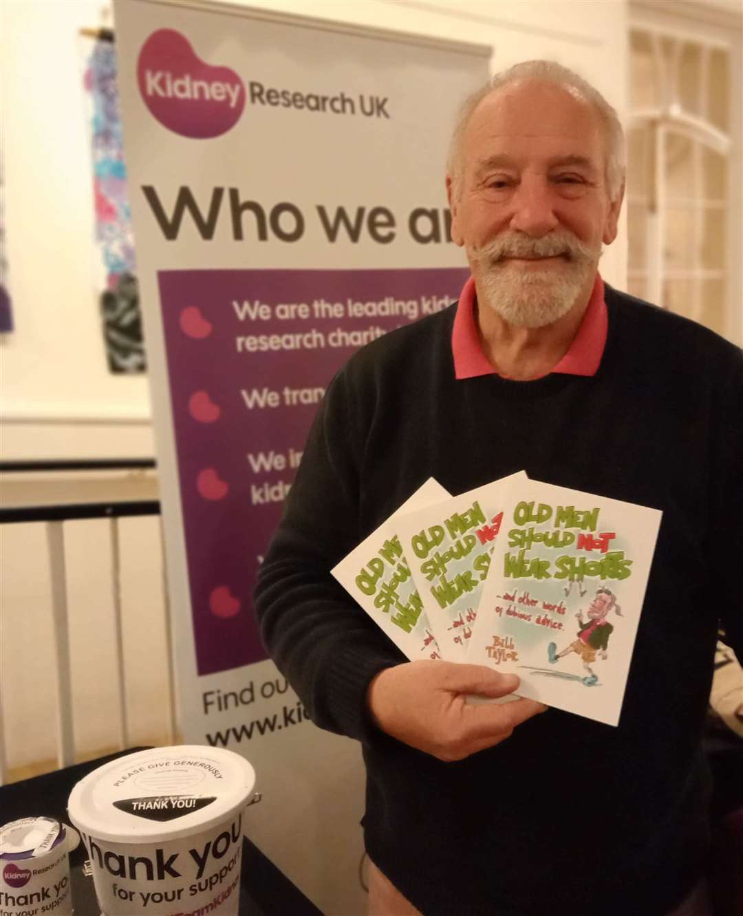 Bill Taylor with copies of his book, Old Men Should Not Wear Shorts