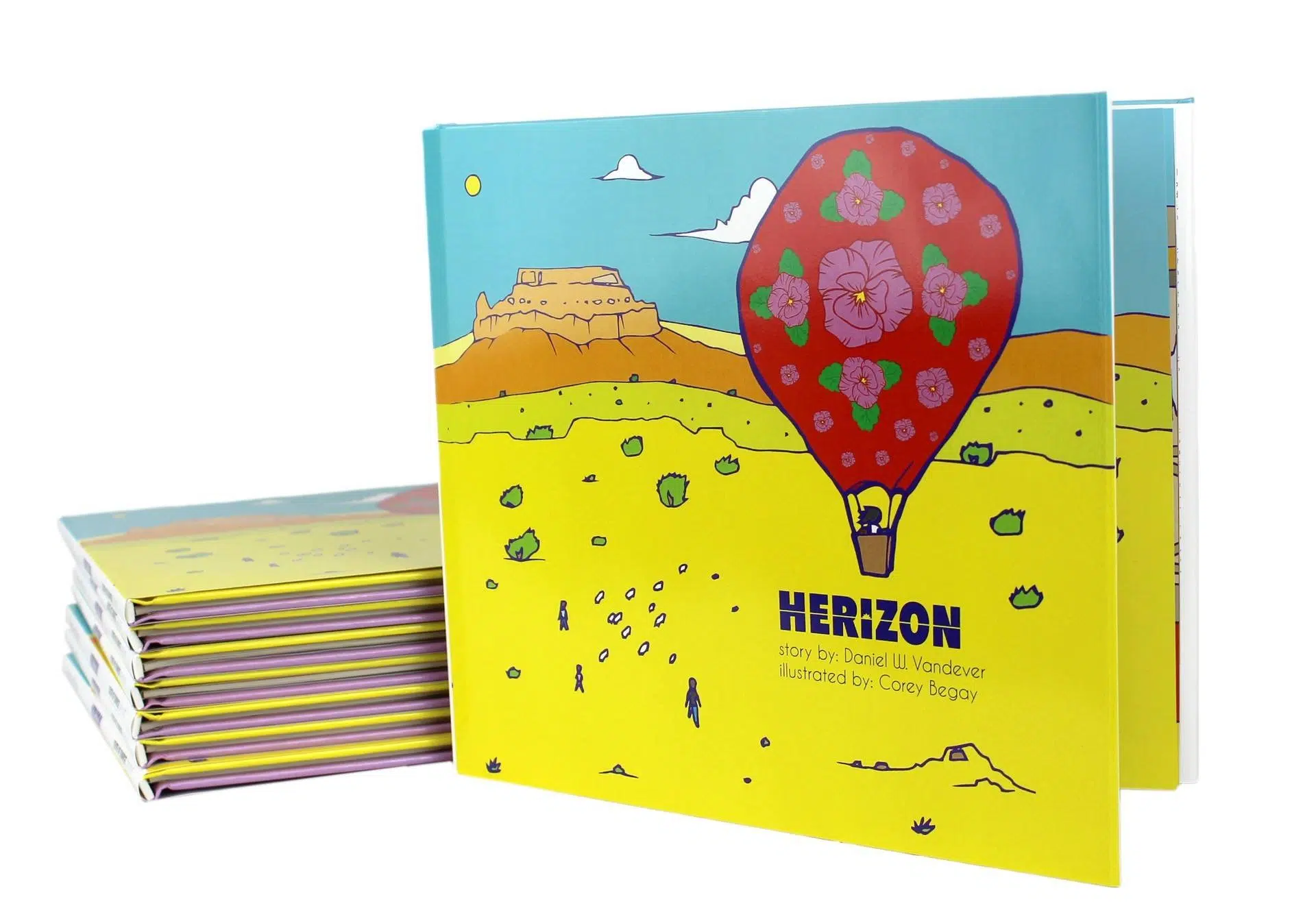 A hardcover print-on-demand book with a cover illustration of a balloon flying over a desert.