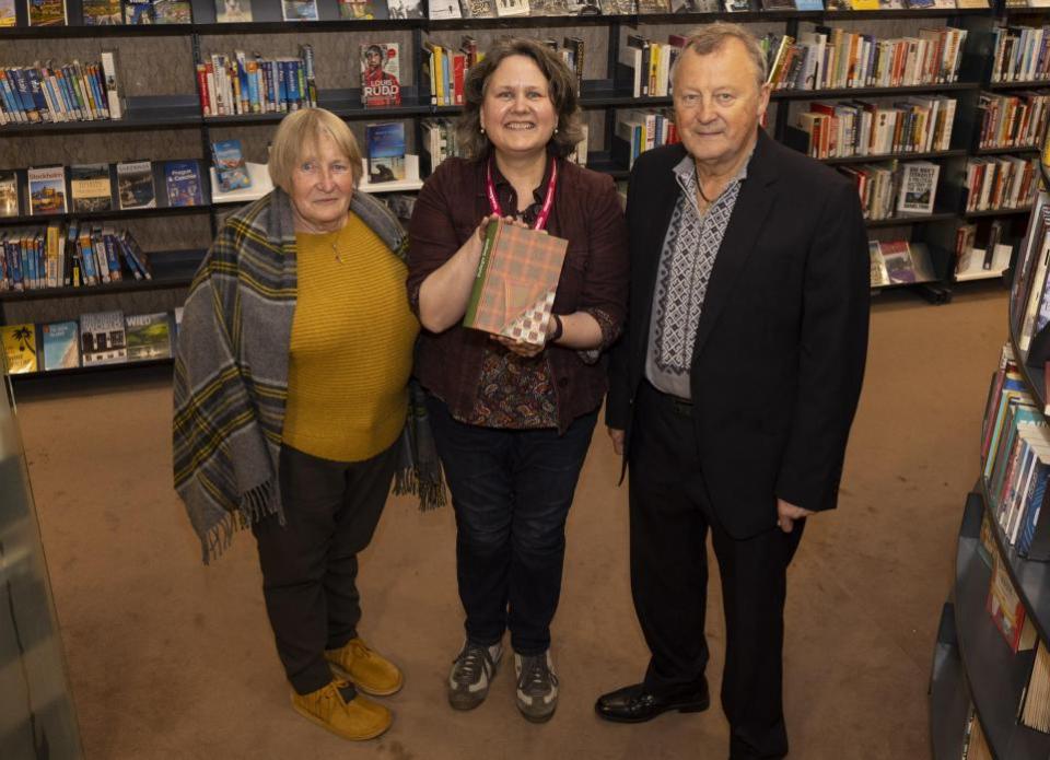 The Herald: Hanna Dyka (left) Dr Peter Kormylo and Susan Taylor with the book 