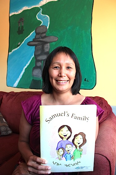 Deborah Tagornak shows off one of three Inuktitut-English children's books she wrote thanks to a Parents as Authors workshop offered by the Ottawa Inuit Children's Centre. Born in Churchill, Manitoba, raised in Repulse Bay and a one-time resident of several Nunavut communities including Iqaluit, Deborah Tagornak now resides in Ottawa. (PHOTO BY LISA GREGOIRE)