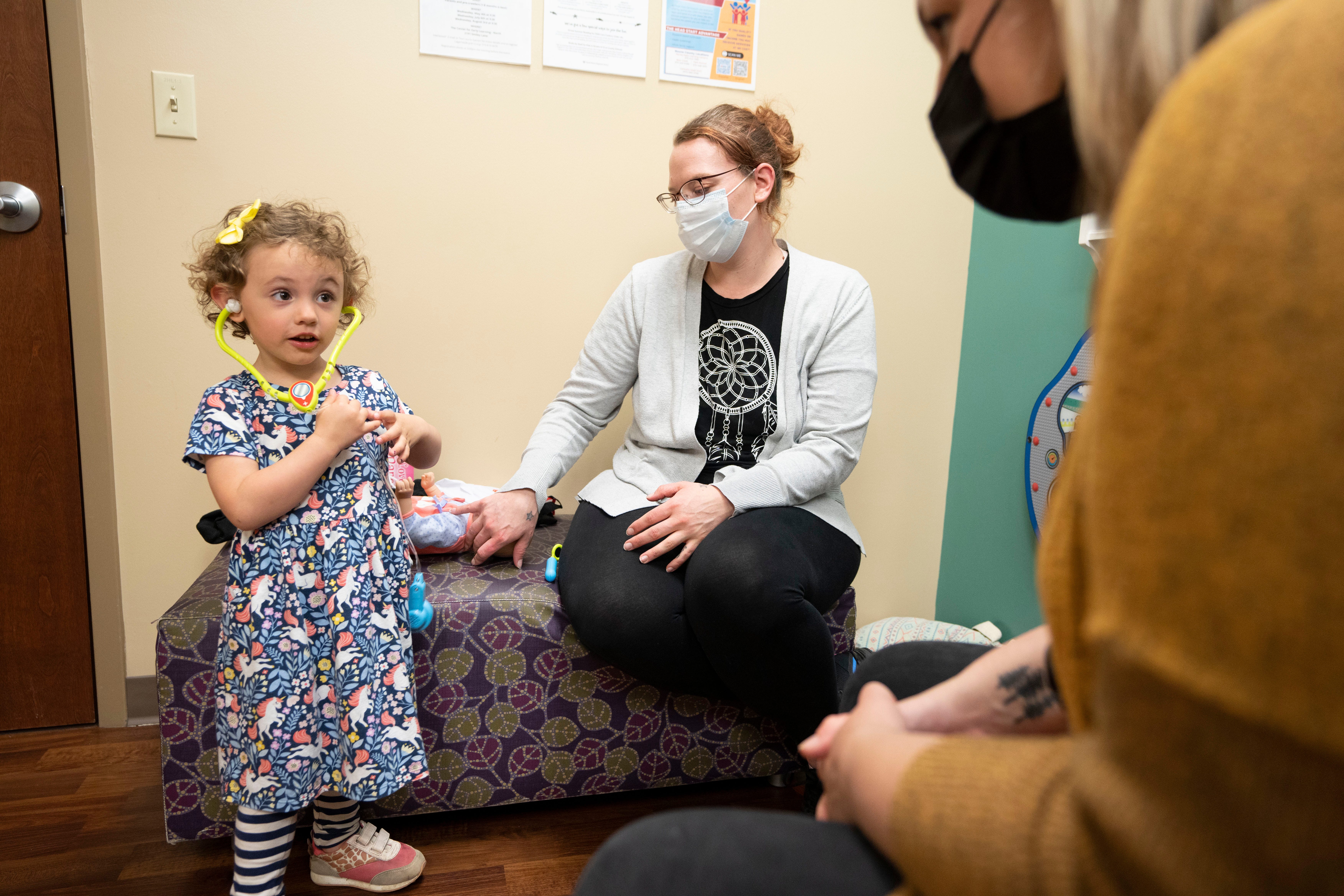 HealthySteps specialist Andrea Pauley accompanies Nylah Mancuso, 3, and her mother. Jessica Mahurin, during Nylah’s checkup at the University of Missouri on April 28 in Columbia.