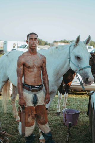Ivan McClellan Photography of shirtless man with a horse