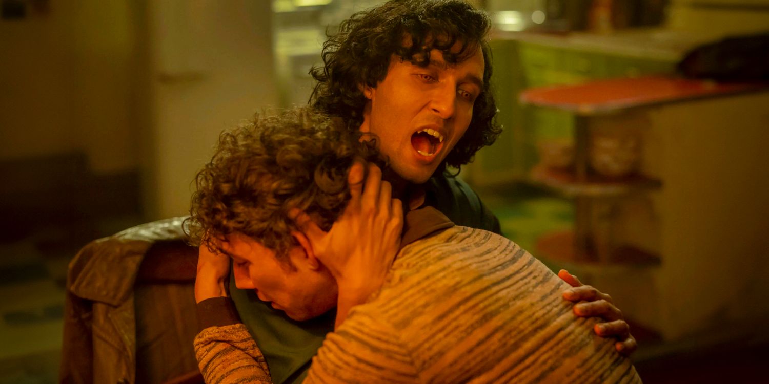 Armand (Assad Zaman) about to bite Young Daniel Molloy (Luke Brandon Field)'s neck in Interview with the Vampire season 2 episode 5